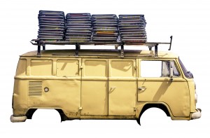 Vintage van in the beach of Ipanema with chairs on the roof